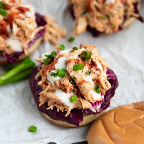 A buffalo chicken sandwich sitting on top of a wooden table