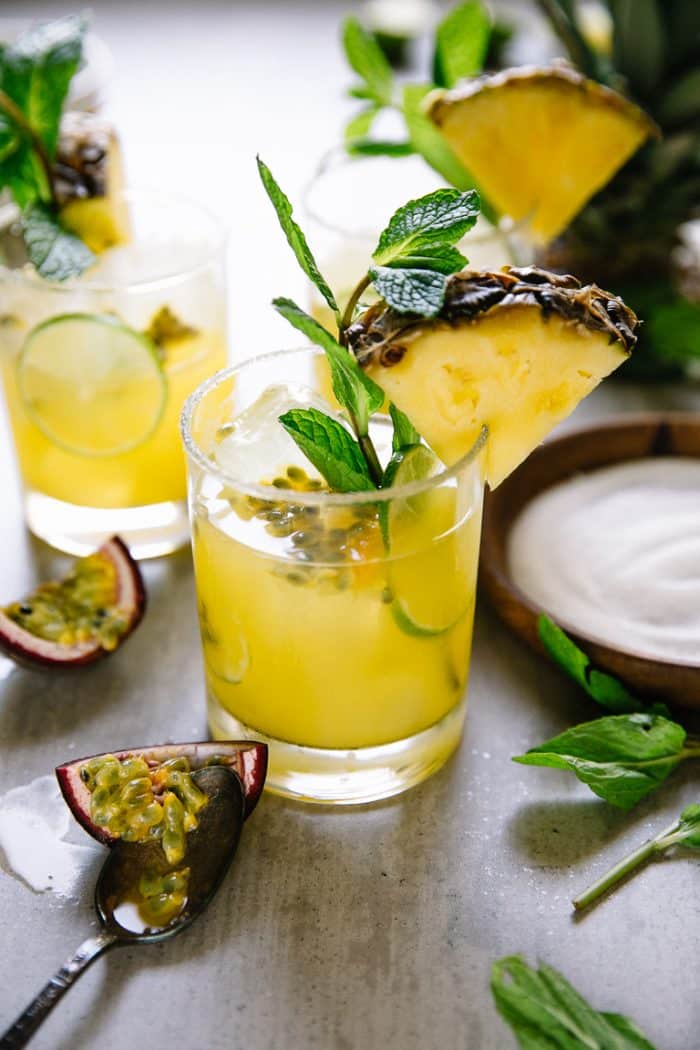 Garnished Passion Fruit Pineapple Margaritas on a table