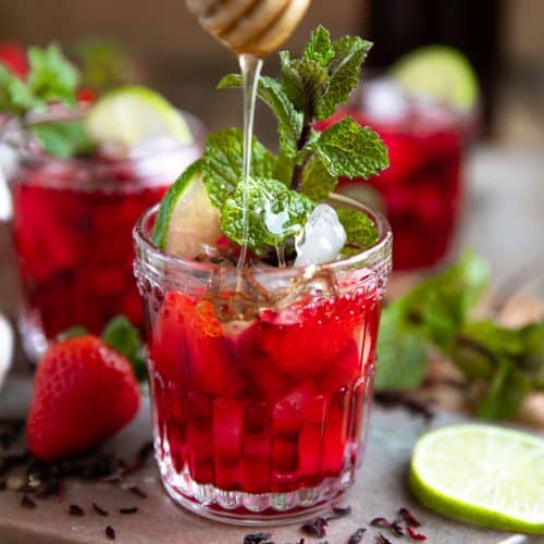 strawberry honey hibiscus ice tea in glass