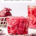 Pinterest pin image of bright pink pickled red onions in a clear glass jar with black peppercorns, whole red onions in the background, and a text overlay reading "Pickled Red Onions" and "quick, easy, ready in 30 minutes!" with "THEFORKEDSPOON.COM" at the bottom.