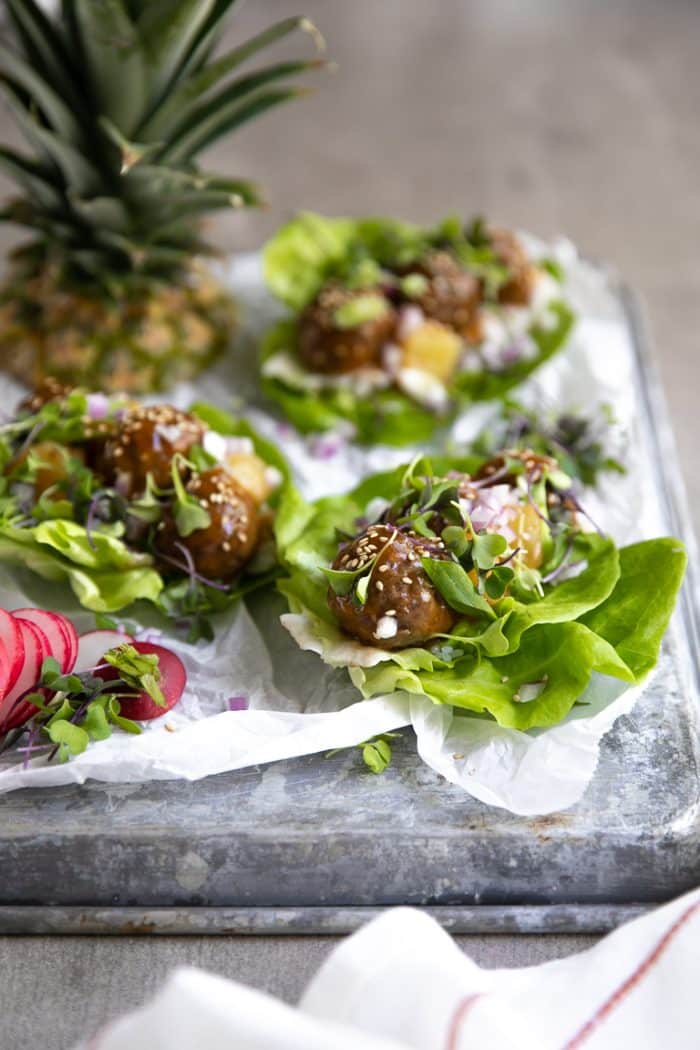 Assembly of Hawaiian meatball lettuce wraps.