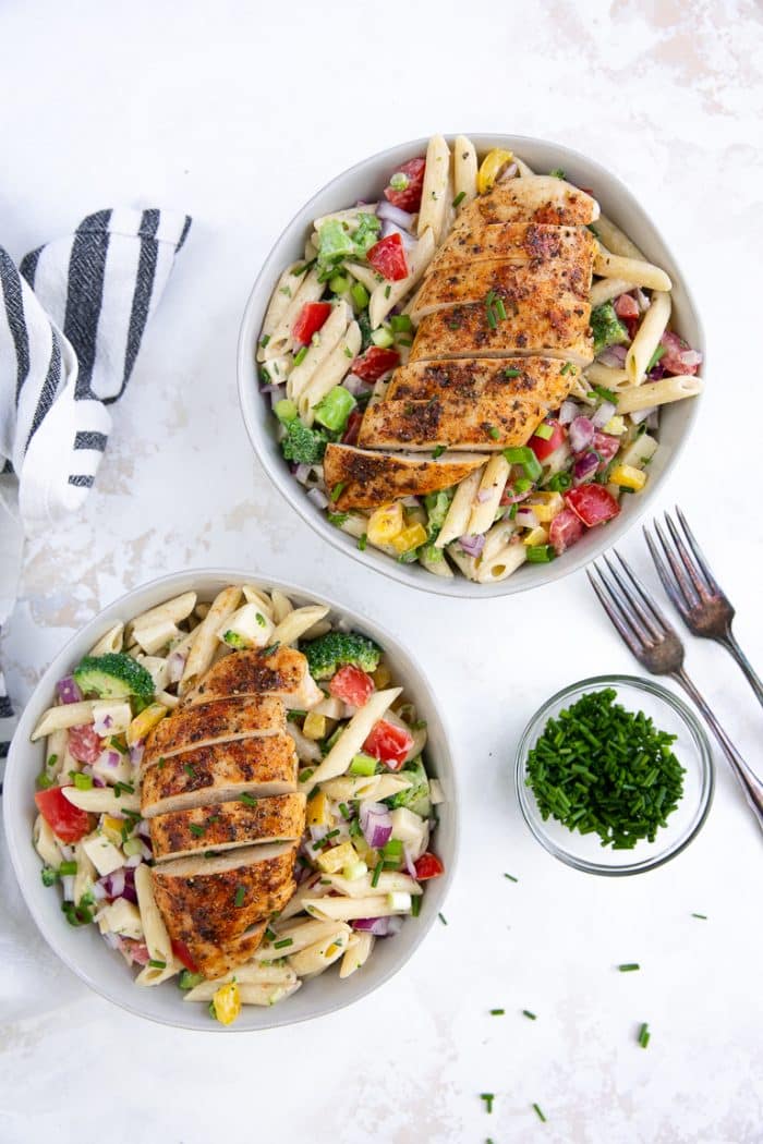 Cold pasta salad with creamy ranch dressing and topped with ranch chicken breasts