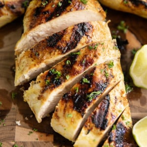 Sliced Citrus Chicken breast on cutting board