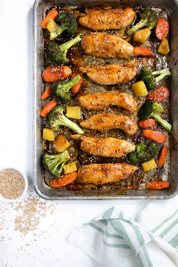 Sheet pan chicken teriyaki tenders with roasted broccoli, carrots, and pineapple