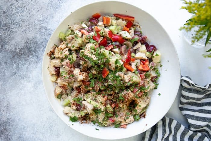 Bowl filled with mixed chicken potato salad.