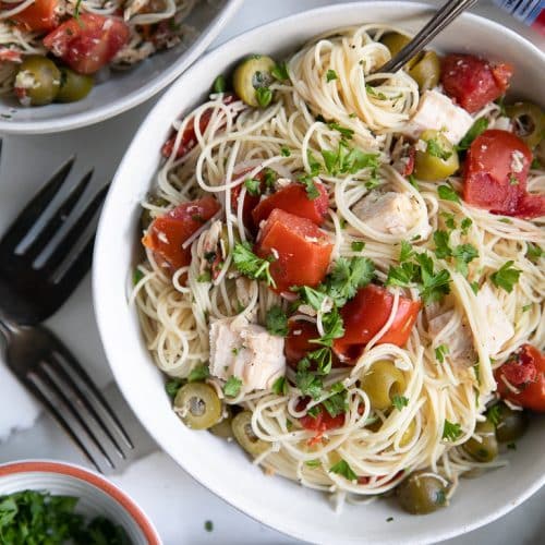 A bowl of angel hair pasta with chicken