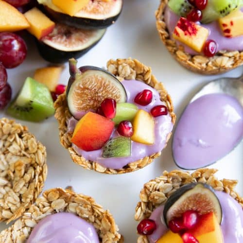Image of Baked oatmeal cups filled with fruit and blueberry yogurt.