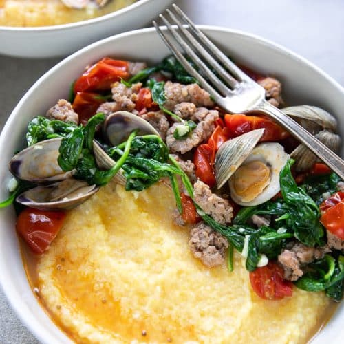 a bowl of sausage Clam and Polenta