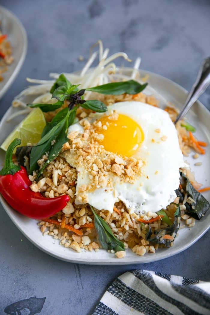 Plate filled with Thai Fried Rice and a Fried Egg on Top