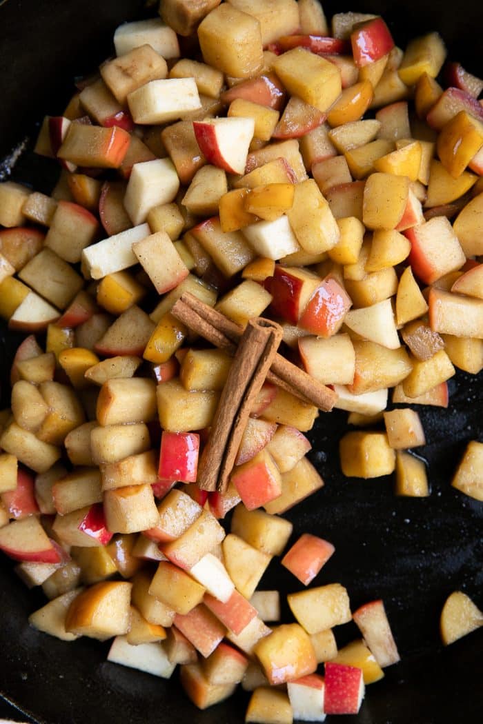 Apples chopped into cubes and fried in a large cast-iron skillet with butter, cinnamon and sugar.
