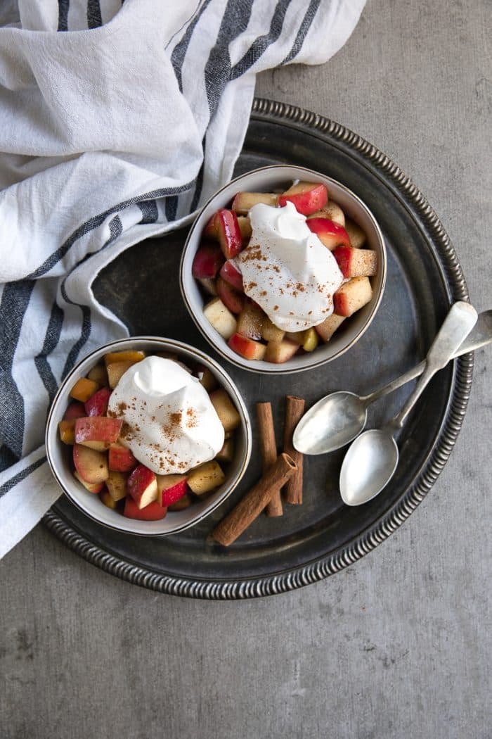 Overhead image of cinnamon fried apples with whipped cream