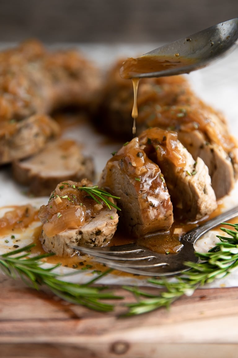 Sliced pork tenderloin drizzled with sweet and savory apple balsamic glaze