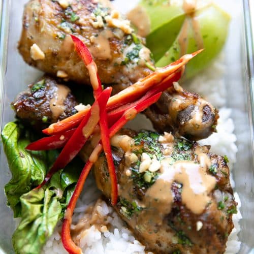 A close up of a Meal Prep container with Thai Chicken bok choy and rice