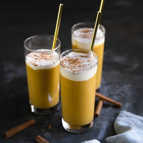 3 glasses full of Pumpkin Smoothie with straws