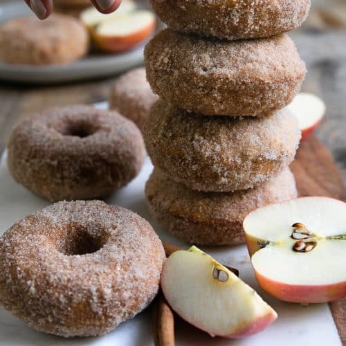 A close up of baked apple doughnuts