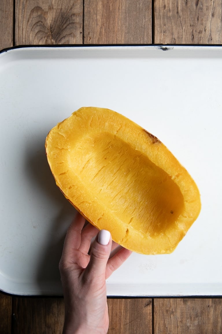 Cooked spaghetti squash on a white tray