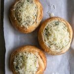 Bread bowls filled with Carb Artichoke Dip