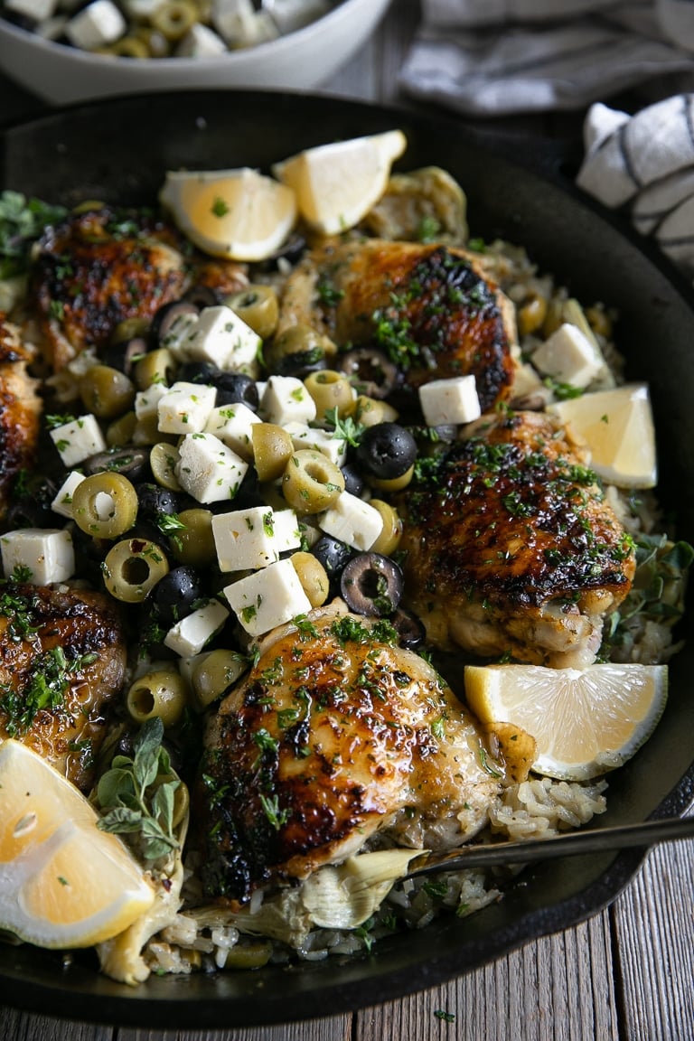 One-pan olive chicken and rice recipe with feta and artichoke hearts.