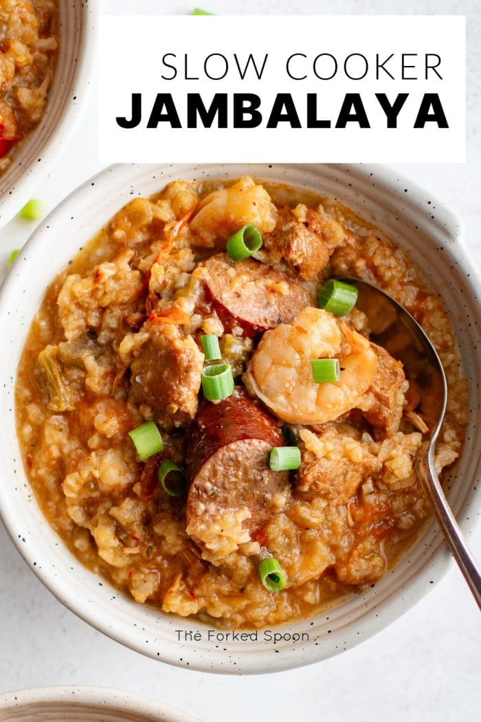 Overhead view of a bowl of jambalaya with a text overlay that reads "Slow Cooker Jambalaya."