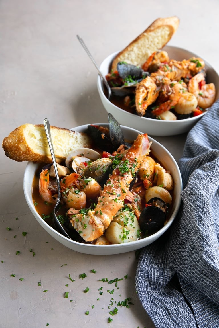 Fulled prepared Cioppino served in wide shallow bowls and served with crispy toasted parmesan bread.