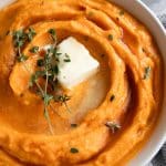 A bowl of mashed sweet potatos