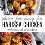 Gluten-free and dairy-free harissa roasted chicken garnished with charred lemon slices and served on a platter with roasted vegetables, including red onions, potatoes, and mushrooms, topped with fresh herbs and pomegranate seeds.