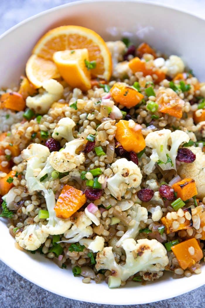 Wheat berries mixed with roasted butternut squash, cauliflower, dried cranberries, and orange shallot vinaigrette.