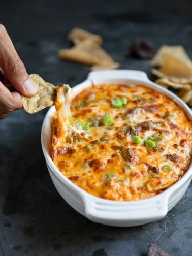Baked Buffalo Chicken Dip Cheese Pull with a tortilla chip.