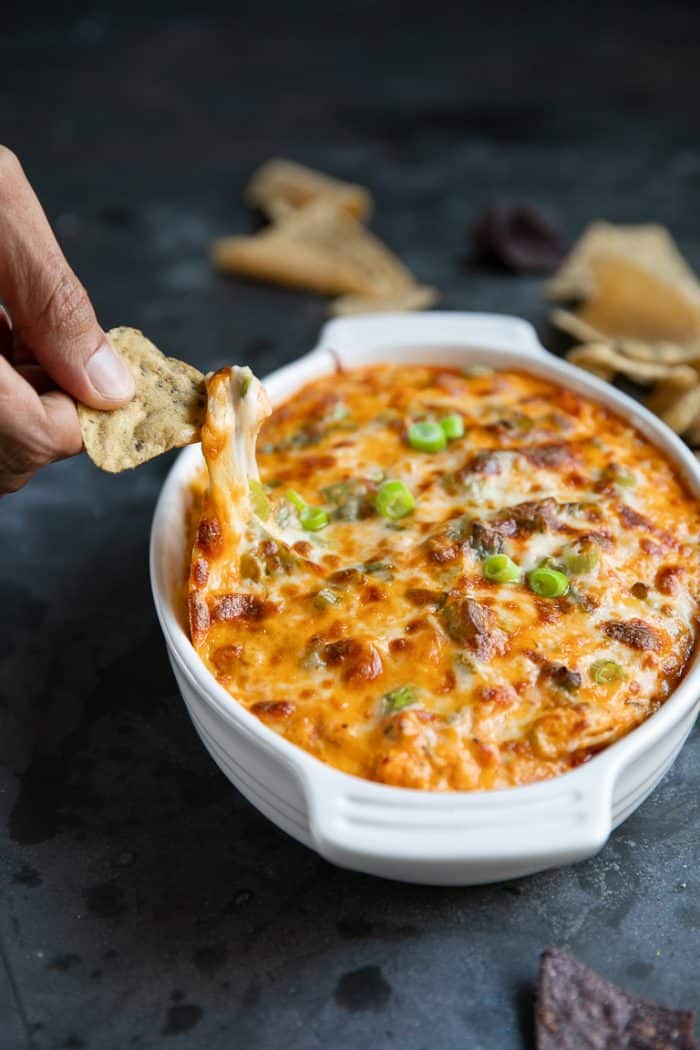 Baked Buffalo Chicken Dip Cheese Pull with a tortilla chip.