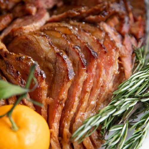 A close up of a sliced slow-cooked ham