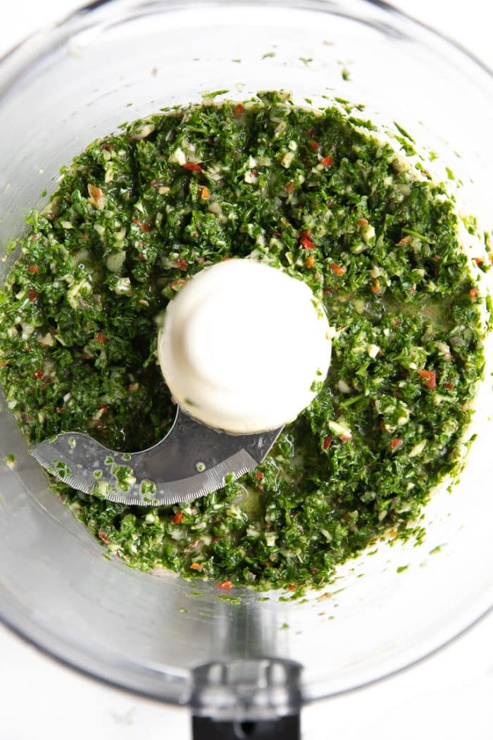 blended parsley, garlic, red wine vinegar, oregano for Chimichurri in food processor 