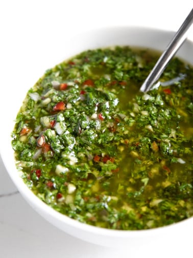 A close up of a bowl Chimichurri