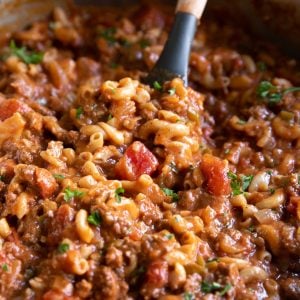 Large pot filled with cheesy, beefy, noodle-filled American goulash ready to be served.