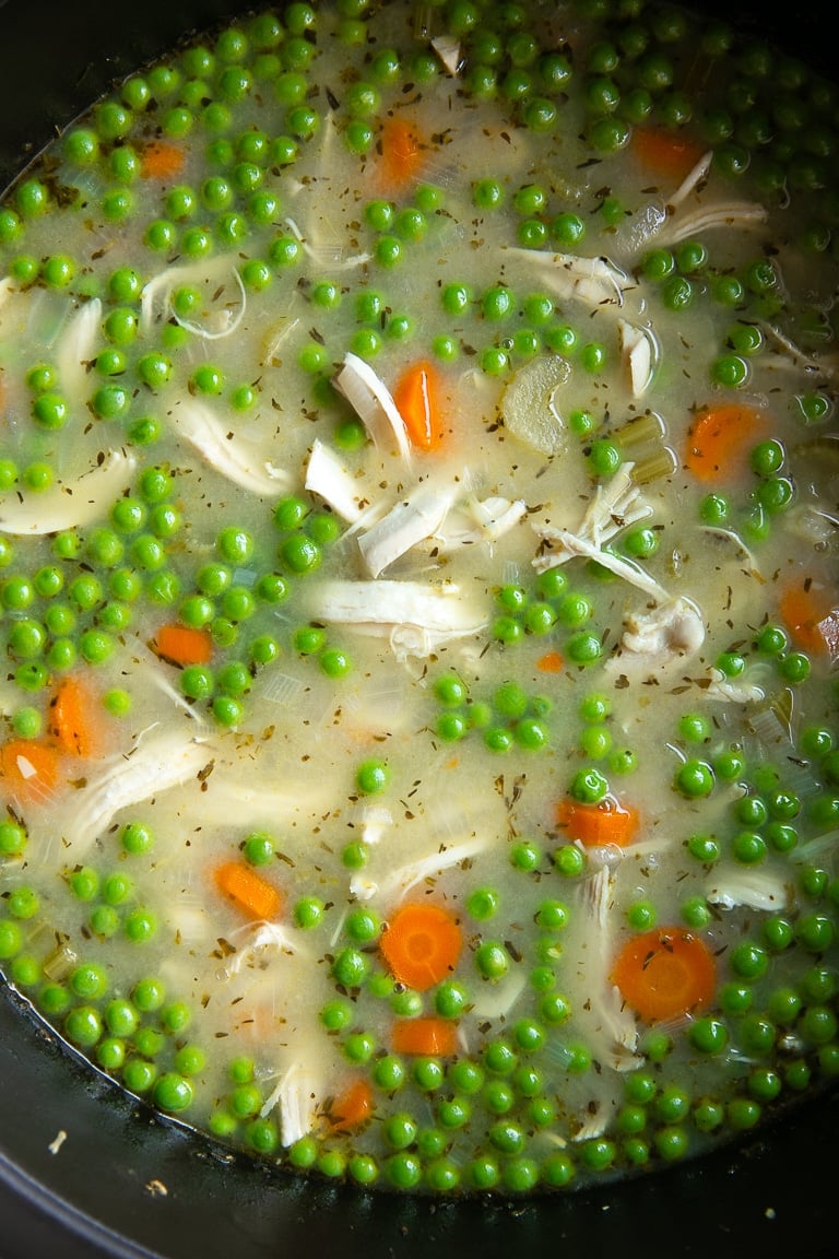 Chicken and dumpling stock filled with shredded chicken ,carrots, celery, and green peas.