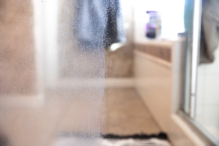 How to Remove Hard Water Stains from Glass Shower Doors - The Forked Spoon
