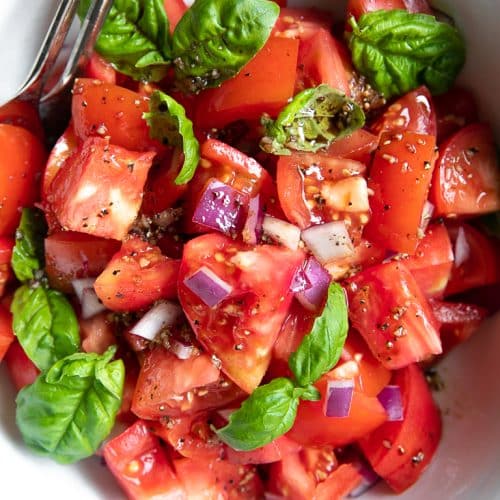 A plate Tomato Basil Salad