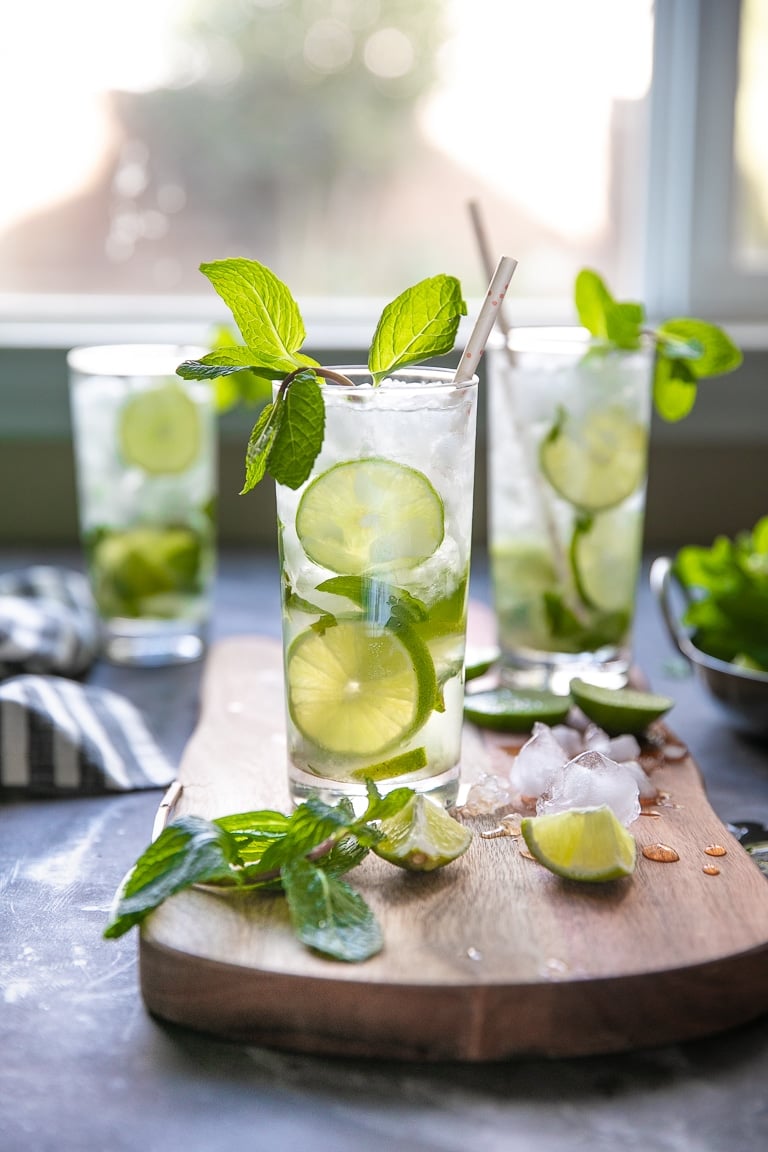 Three classic Mojitos made with white rum, lime juice, fresh mint, sugar, and club soda.