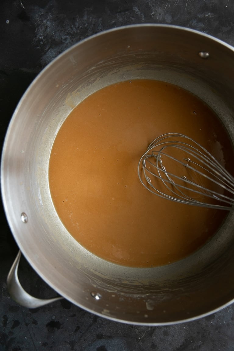 Dark gumbo roux in a large pot.
