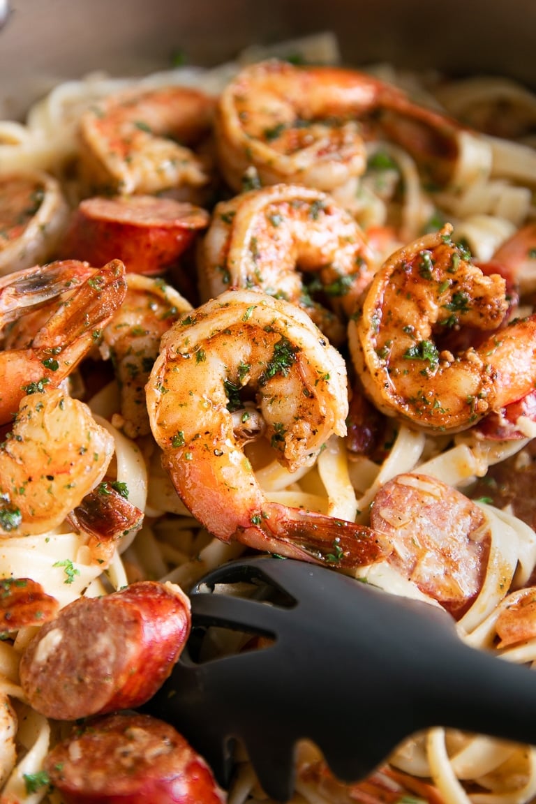 Large pot filled with creamy fettuccine pasta and Cajun seasoned shrimp.