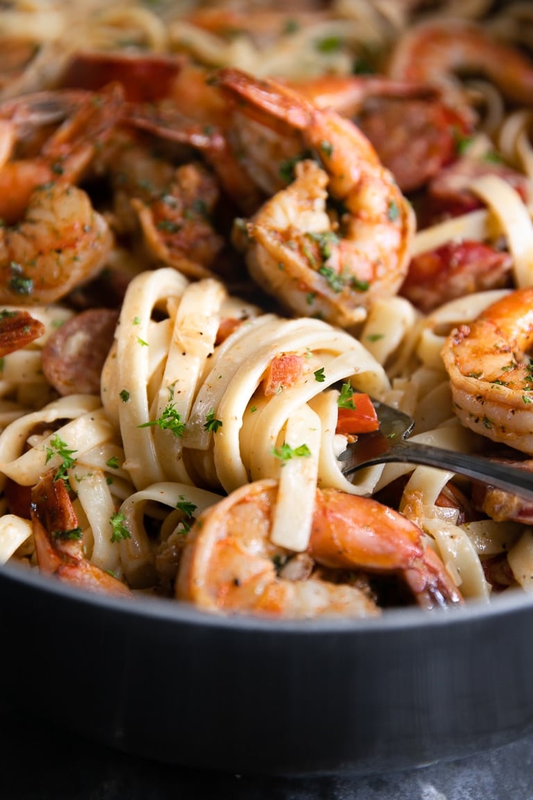 Cajun Shrimp and fettuccine noodles wrapped around a fork.