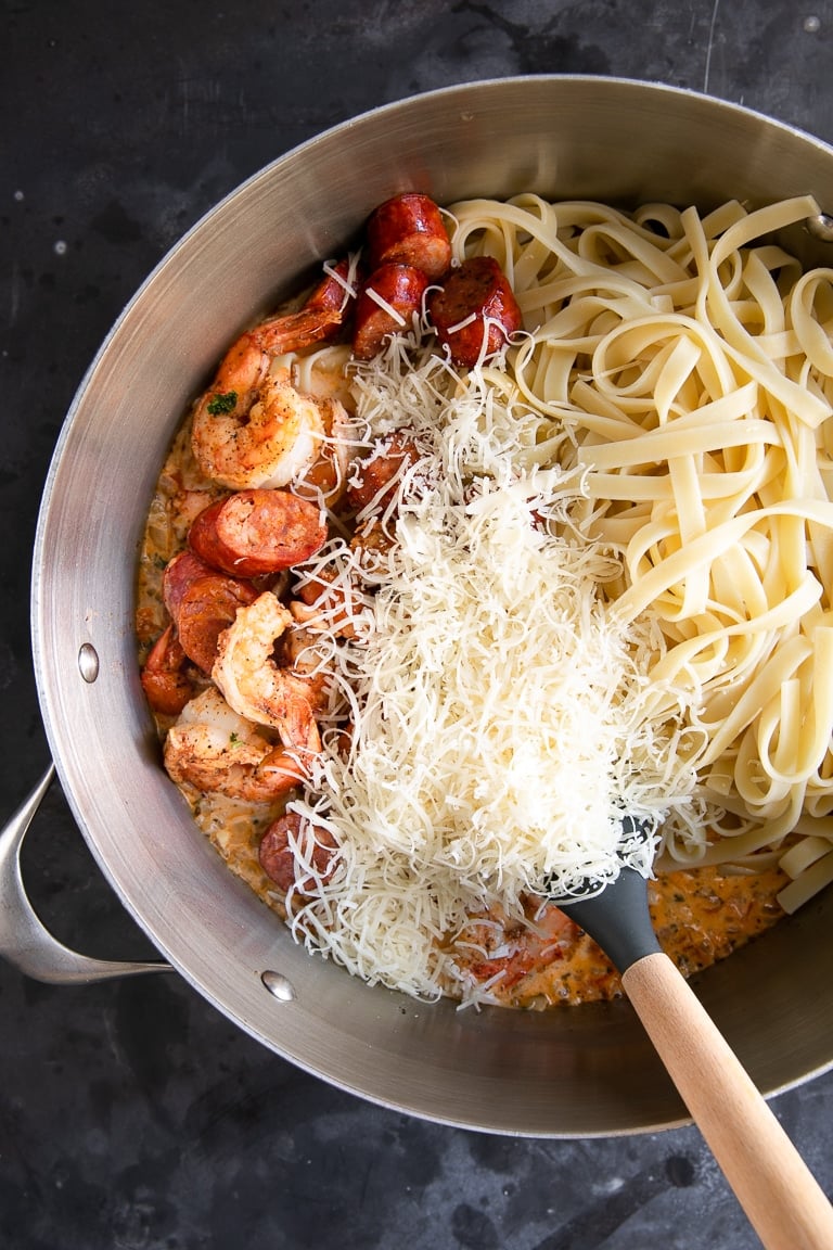 A pot of noodles with cheese and cajun shrimp pasta