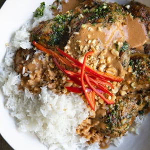 A plate of food with rice and Grilled Thai Peanut Chicken