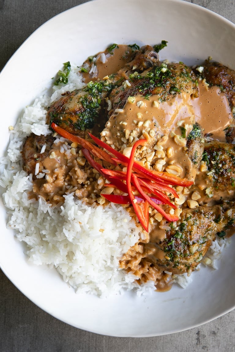 A plate of food with rice and Grilled Thai Peanut Chicken