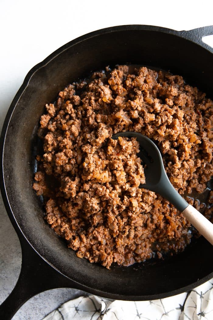 Cast Iron Skillet filled with ground beef taco meat.