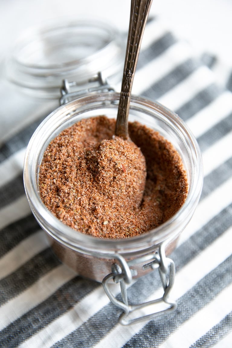 Glass jar filled with homemade taco seasoning.