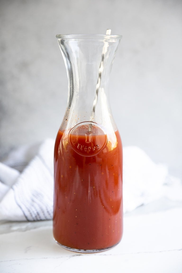 Large pitcher filled with homemade Clamato Juice.