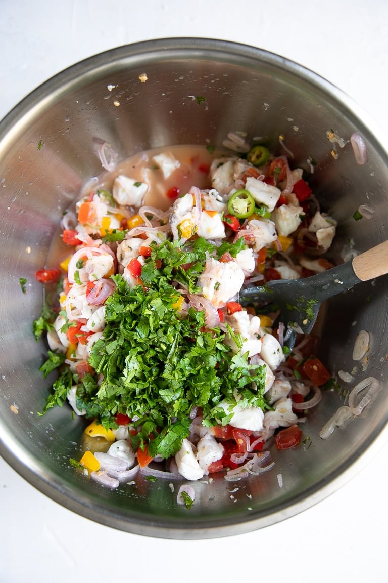 Mixing bowl filled with prepared fish ceviche.