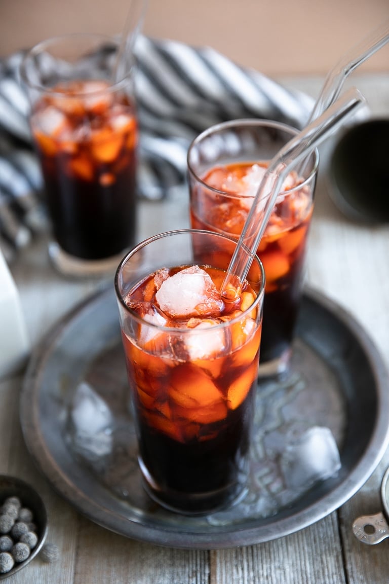 Glasses filled with ice cold thai tea and boba pearls.