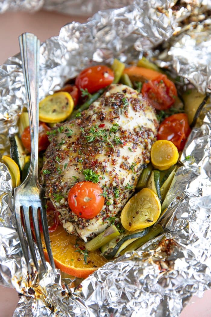 Chicken breast and vegetables cooked in foil with honey mustard sauce.