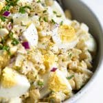 Close up image of mixed together egg salad.